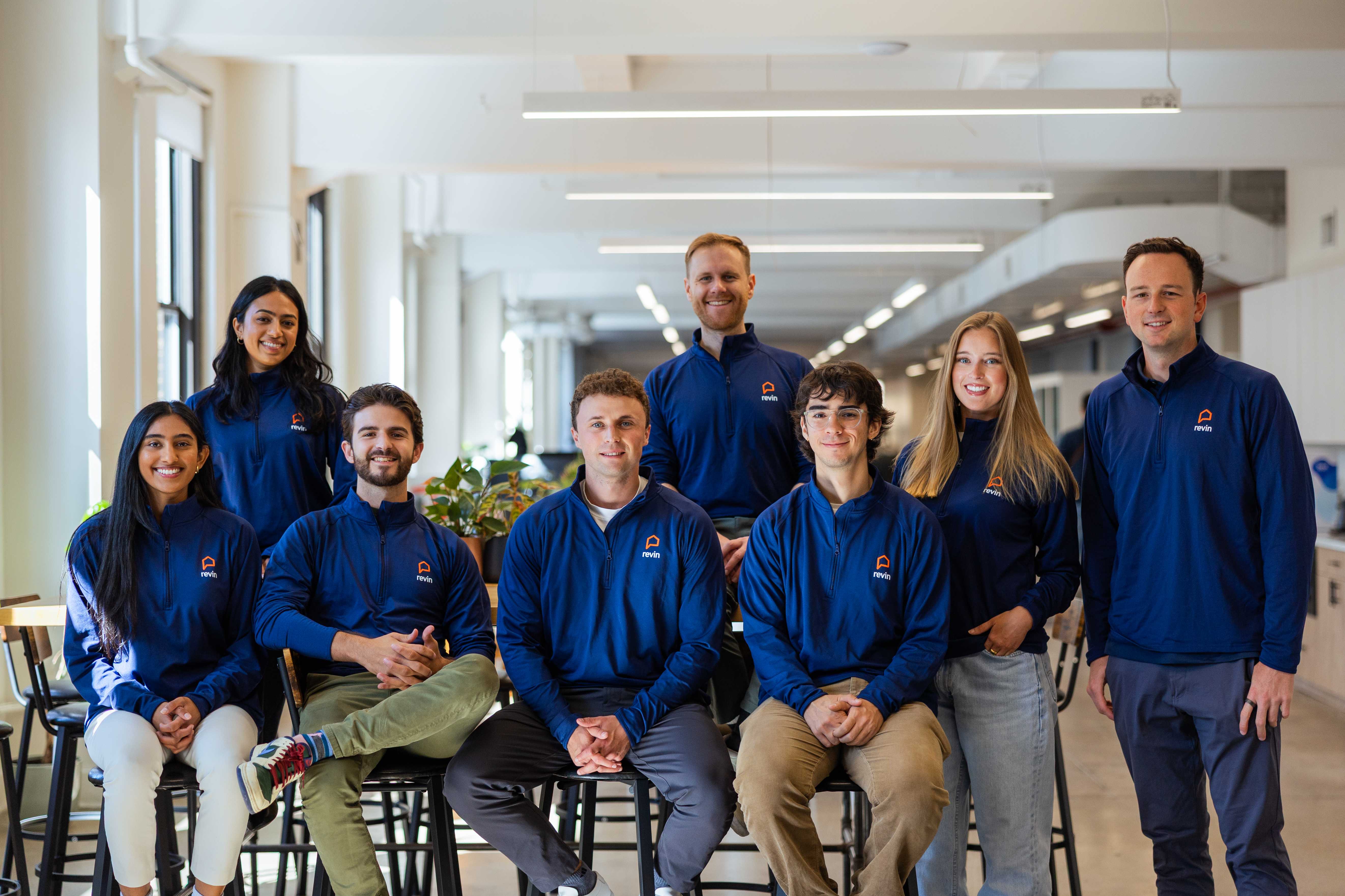 Revin team collaborating in modern office